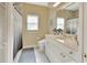 Clean bathroom with a shower/tub combo, toilet, and vanity with a large mirror at 376 Hampton Hills Ct, Debary, FL 32713