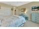 Bedroom with a full bed, dresser and a TV at 376 Hampton Hills Ct, Debary, FL 32713