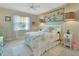 Guest bedroom with a full-size bed and decorative wall art at 376 Hampton Hills Ct, Debary, FL 32713