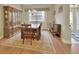 Formal dining room with hardwood floors, a large table, and built-in hutch at 376 Hampton Hills Ct, Debary, FL 32713