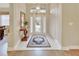 Bright and airy entryway with hardwood floors and a large front door at 376 Hampton Hills Ct, Debary, FL 32713