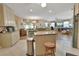 Open concept kitchen with granite countertops and island, stainless steel appliances at 376 Hampton Hills Ct, Debary, FL 32713