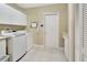 Convenient laundry room with washer, dryer, and extra storage at 376 Hampton Hills Ct, Debary, FL 32713