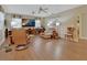 Relaxing living room with hardwood floors, comfortable seating, and built in shelving at 376 Hampton Hills Ct, Debary, FL 32713