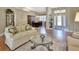 Living area with hardwood floors, a view into the dining room and entryway at 376 Hampton Hills Ct, Debary, FL 32713