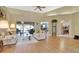 Spacious living room featuring hardwood floors and access to a back patio at 376 Hampton Hills Ct, Debary, FL 32713