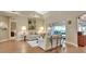 Living room with hardwood floors, large windows, and comfortable seating at 376 Hampton Hills Ct, Debary, FL 32713