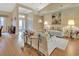 Open living room with hardwood floors, neutral colors, and ample natural light at 376 Hampton Hills Ct, Debary, FL 32713