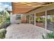 Outdoor patio with retractable awning, creating a shaded seating area at 376 Hampton Hills Ct, Debary, FL 32713