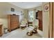 Relaxing sitting room with two comfy armchairs and built-in shelving at 376 Hampton Hills Ct, Debary, FL 32713