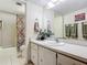 Clean bathroom with a shower/tub combo and vanity at 3800 S Atlantic Ave # 4080, Daytona Beach, FL 32118