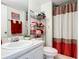 Clean bathroom with shower/tub combo and storage at 3800 S Atlantic Ave # 4080, Daytona Beach, FL 32118