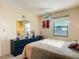 Well-lit bedroom featuring a dresser and a comfortable bed at 3800 S Atlantic Ave # 4080, Daytona Beach, FL 32118