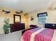 Bedroom with a dresser, bed, and airplane decor at 3800 S Atlantic Ave # 4080, Daytona Beach, FL 32118