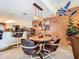 Small dining area with round table and four chairs at 3800 S Atlantic Ave # 4080, Daytona Beach, FL 32118
