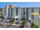 Ocean Terrace Club condo building exterior, showing parking and landscaping at 3800 S Atlantic Ave # 4080, Daytona Beach, FL 32118