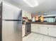 View of kitchen with stainless steel appliances and white cabinets at 3800 S Atlantic Ave # 4080, Daytona Beach, FL 32118