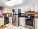 Stainless steel appliances and white cabinets in kitchen at 3800 S Atlantic Ave # 4080, Daytona Beach, FL 32118
