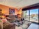 Living room with ocean view and brown couch at 3800 S Atlantic Ave # 4080, Daytona Beach, FL 32118