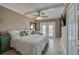Bright bedroom with a comfortable queen-size bed and access to a balcony at 404 S Beach St # 240 701, Daytona Beach, FL 32114