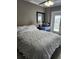 Bedroom with a comfortable bed and access to balcony at 404 S Beach St # 240 701, Daytona Beach, FL 32114