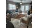 Spacious living room with tiled floors and comfy furniture at 404 S Beach St # 240 701, Daytona Beach, FL 32114