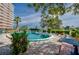Relaxing kidney-shaped pool with patio furniture at 404 S Beach St # 240 701, Daytona Beach, FL 32114