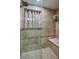 Large walk-in shower with tiled walls and seat at 404 S Beach St # 240 701, Daytona Beach, FL 32114