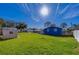 Large backyard with shed and partial view of blue house at 420 S Willow Ave, Port Orange, FL 32127