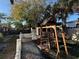 Backyard with playset and gravel pathway at 444 S Deerwood Ave, Orlando, FL 32825