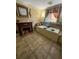 Bathroom with fireplace and jacuzzi bathtub at 444 S Deerwood Ave, Orlando, FL 32825