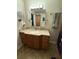Bathroom with vanity, sink, and mirror at 444 S Deerwood Ave, Orlando, FL 32825