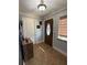 Bright entryway with tile floors and a wooden door at 444 S Deerwood Ave, Orlando, FL 32825