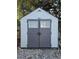 White and gray Craftsman storage shed in backyard at 444 S Deerwood Ave, Orlando, FL 32825