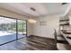 Elegant dining room with chandelier and view of the pool at 446 N Pine Meadow Dr, Debary, FL 32713