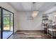 Bright dining area with chandelier and access to the kitchen at 446 N Pine Meadow Dr, Debary, FL 32713