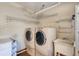 Laundry room with washer, dryer, and utility sink at 446 N Pine Meadow Dr, Debary, FL 32713