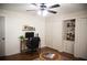 Home office features built-in shelving, hardwood floors, and ample storage at 45 Palmetto Dr, Debary, FL 32713