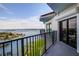 Balcony with water views and roll-down shutters at 501 N Causeway # 8060, New Smyrna Beach, FL 32169