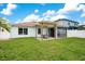 Backyard with pergola, patio, and grassy area at 524 Aeolian Dr, New Smyrna Beach, FL 32168