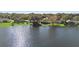 Aerial view of lakefront homes with lush landscaping at 524 Quail Hill Dr, Debary, FL 32713