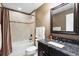 Updated bathroom features a tub, shower, granite vanity, and stylish tile at 524 Quail Hill Dr, Debary, FL 32713