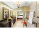 Luxurious bathroom with double sinks, a shower, and a view of the bedroom at 524 Quail Hill Dr, Debary, FL 32713