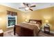 Comfortable bedroom with wood flooring and ceiling fan at 524 Quail Hill Dr, Debary, FL 32713