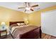 Cozy bedroom with double bed, ceiling fan, and ample closet space at 524 Quail Hill Dr, Debary, FL 32713