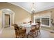 Charming dining room with wood table and chairs at 524 Quail Hill Dr, Debary, FL 32713