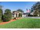 House exterior with stone accents and American flag at 524 Quail Hill Dr, Debary, FL 32713