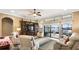 Spacious living room with lake views and comfy seating at 524 Quail Hill Dr, Debary, FL 32713