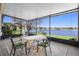 Enjoy the lake view from this screened porch with dining set at 524 Quail Hill Dr, Debary, FL 32713