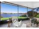 Spacious screened-in porch with lake view and seating area at 524 Quail Hill Dr, Debary, FL 32713